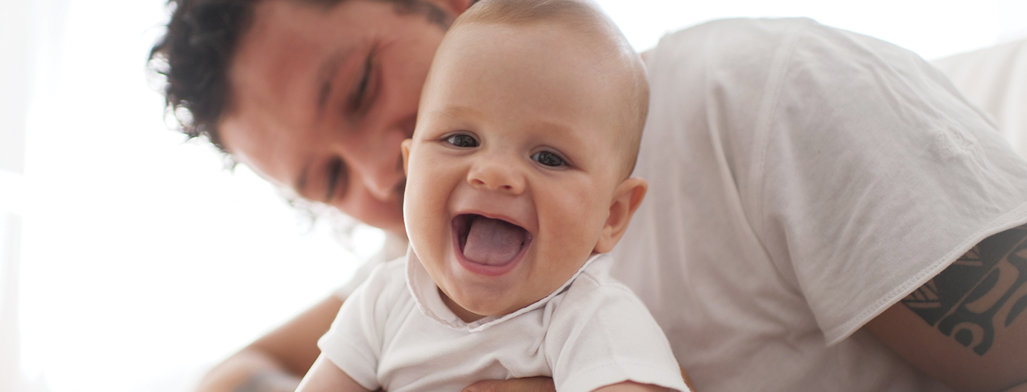 father and baby playing