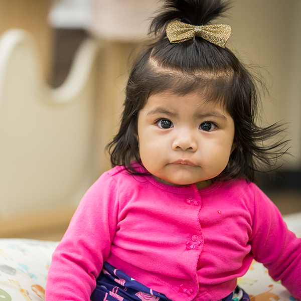 Little girl in pink sweater