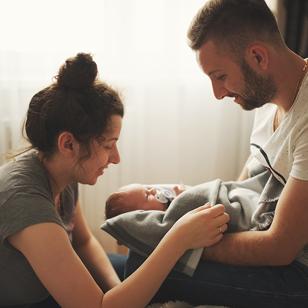 Parents holding newborn baby