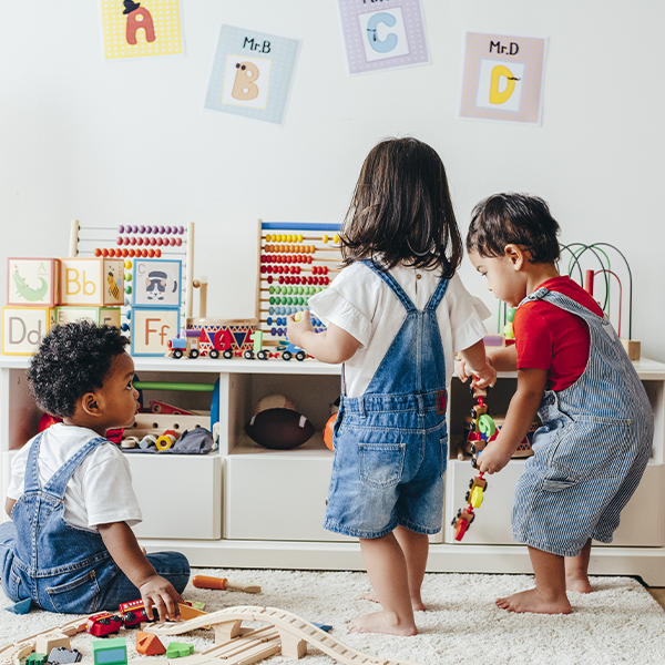 toddlers playing in classroom