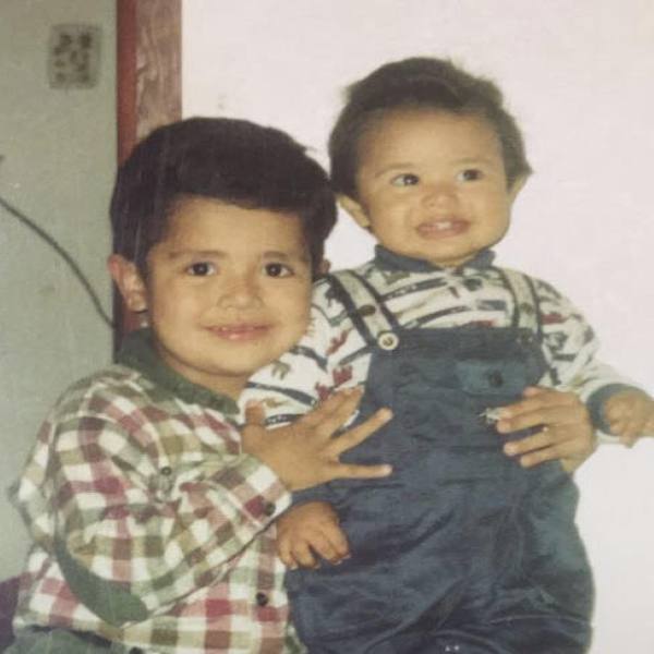 Jesse Rojo alongside his brother as children