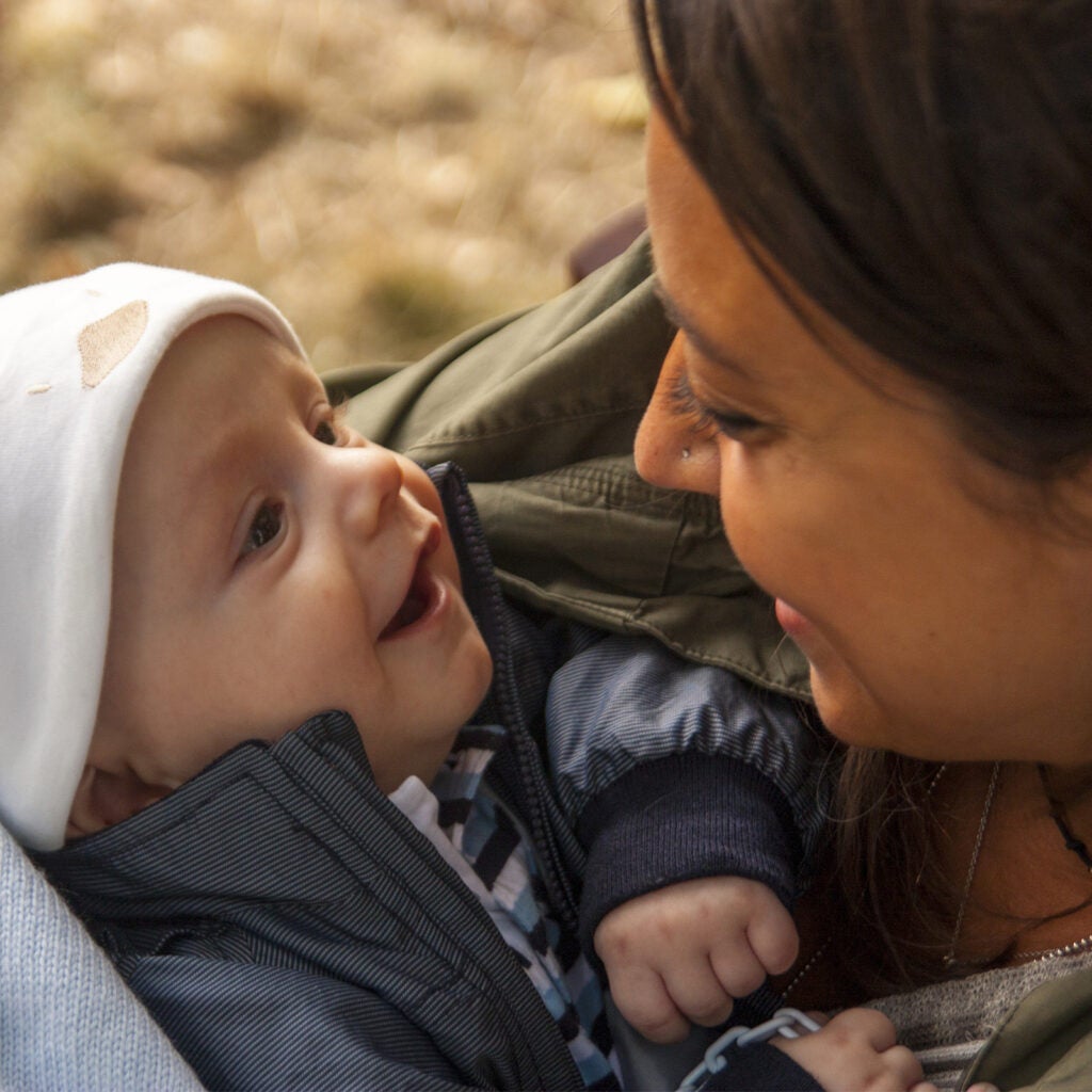 1600x1600_Baby Smiling at Caregiver