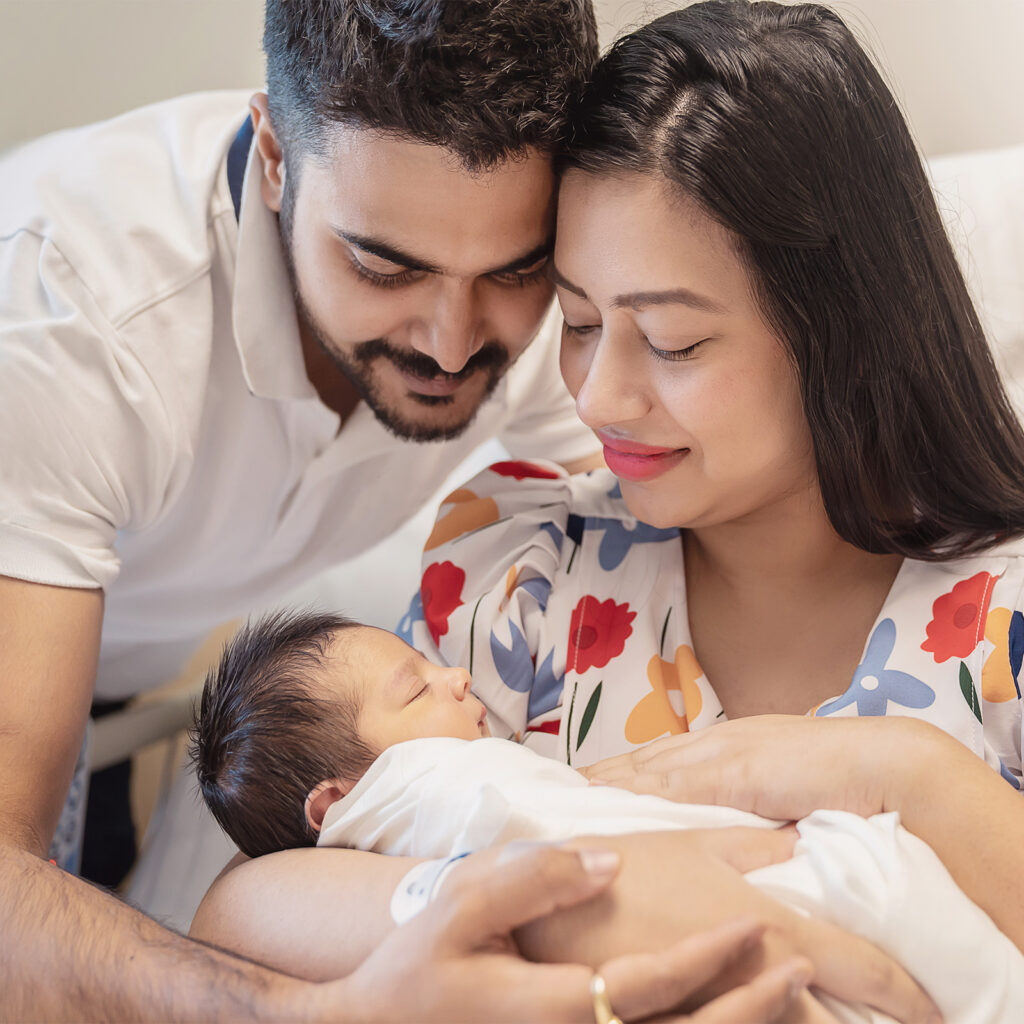 ethnic family holding baby 1600x1600 ethnic family holding baby 1600x1600