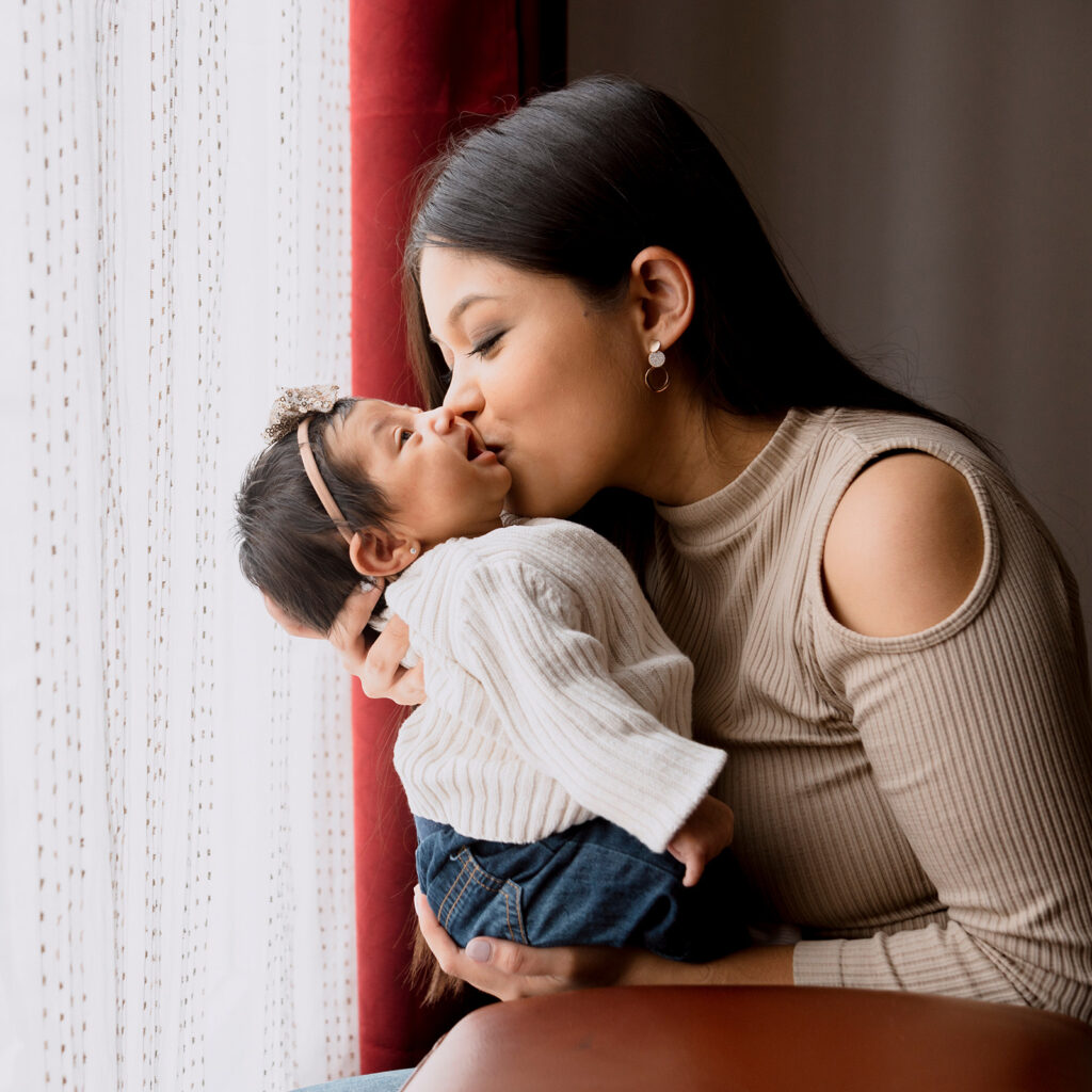 mom kissing baby 1600x1600